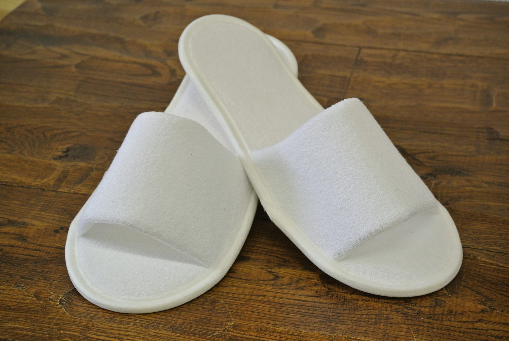 Одноразовые тапочки для гостиничных номеров с доставкой из Китая крупным оптом